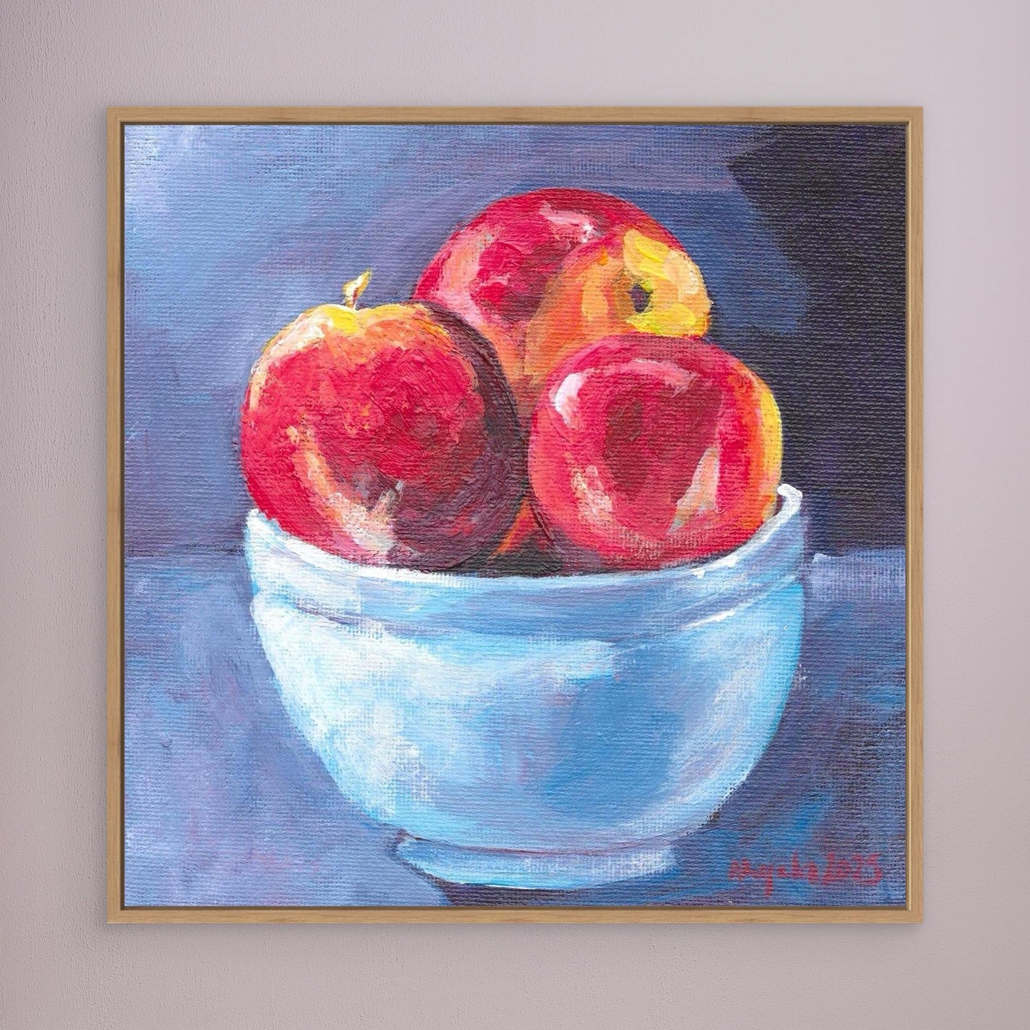 Red apples in blue bowl