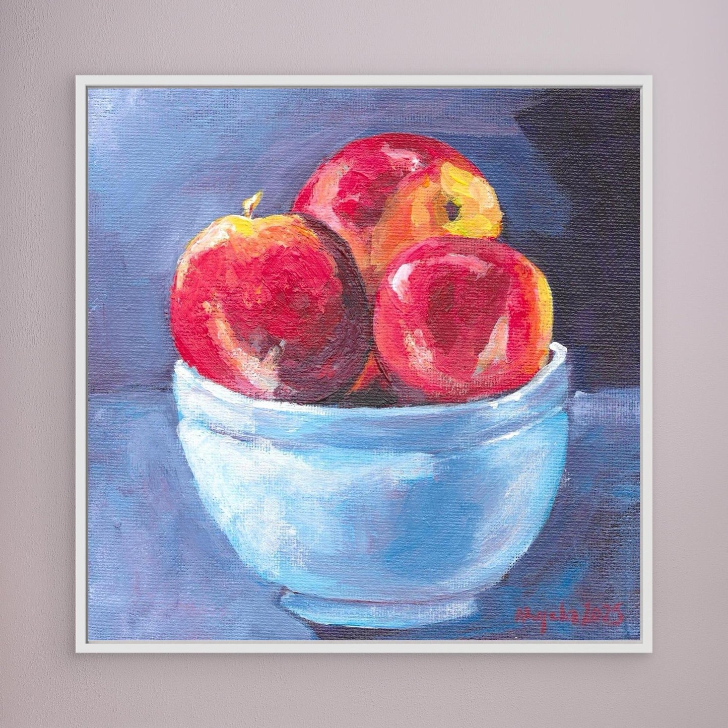 Red apples in blue bowl
