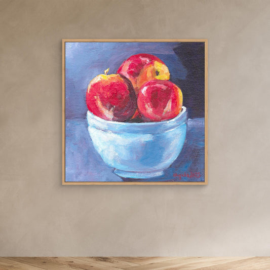 Red apples in blue bowl