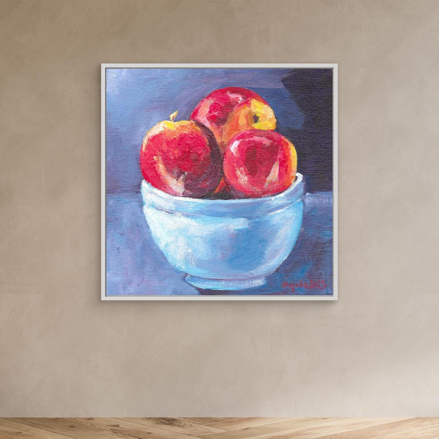 Red apples in blue bowl