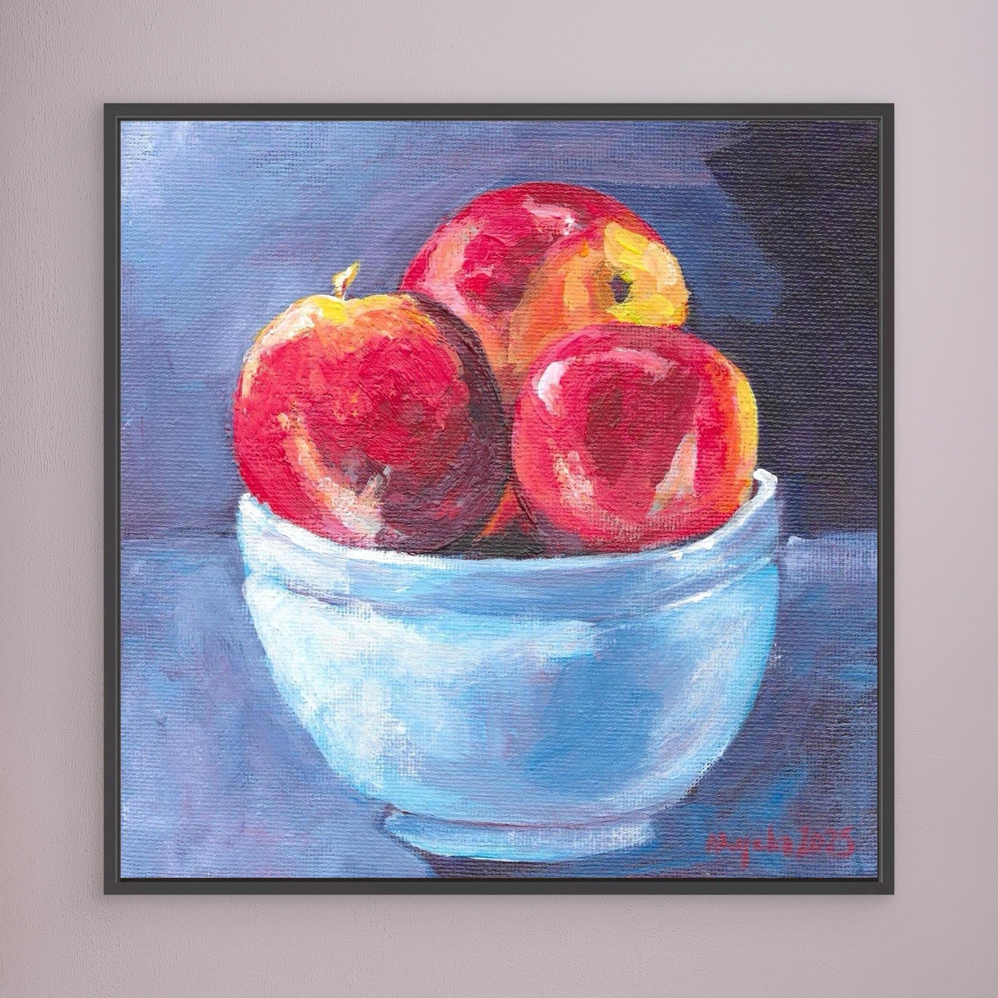 Red apples in blue bowl